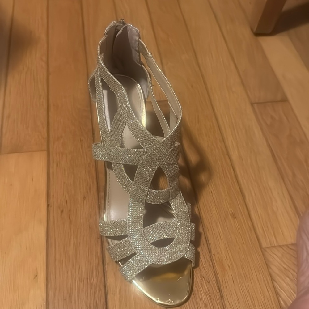 9 1/2M Marc Fisher, gold party shoe.  2” heel in great condition.